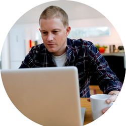 a man working from home on his computer