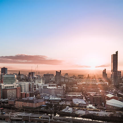 sunset over the city of manchester