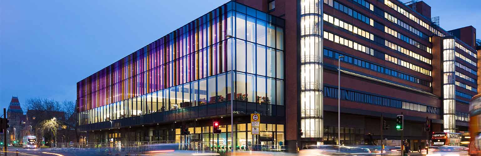 alliance manchester business school building in the evening 