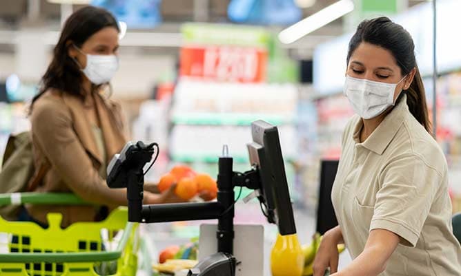 supermarket checkout woman wearing face mask