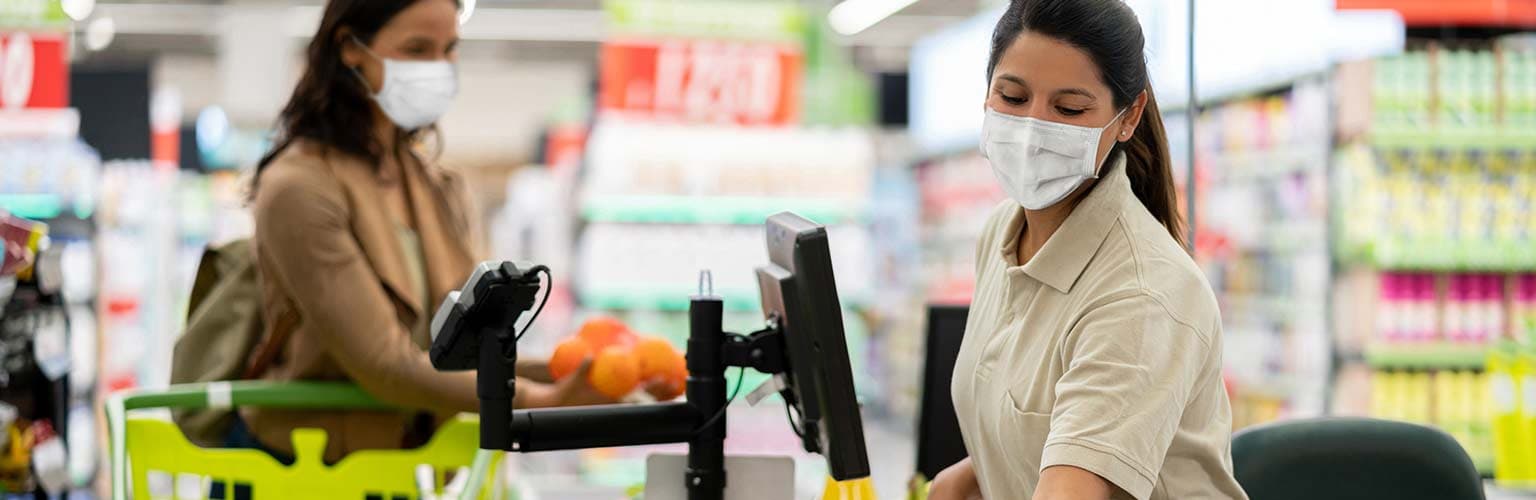 supermarket checkout woman wearing face mask