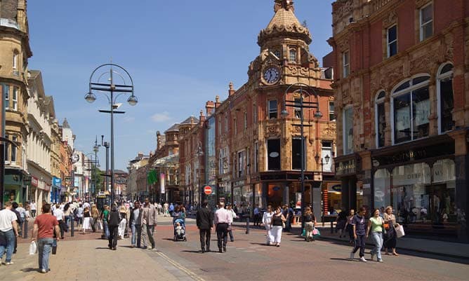 A picture of a UK high street with shoppers