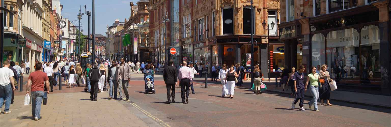 A picture of a UK high street with shoppers