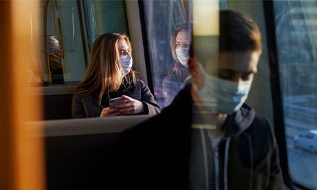 people wearing masks on public transport