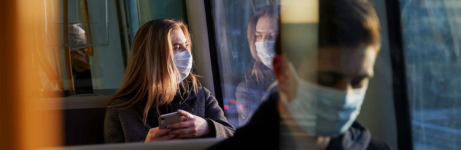 people wearing masks on public transport