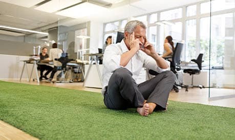 a man meditating in the office