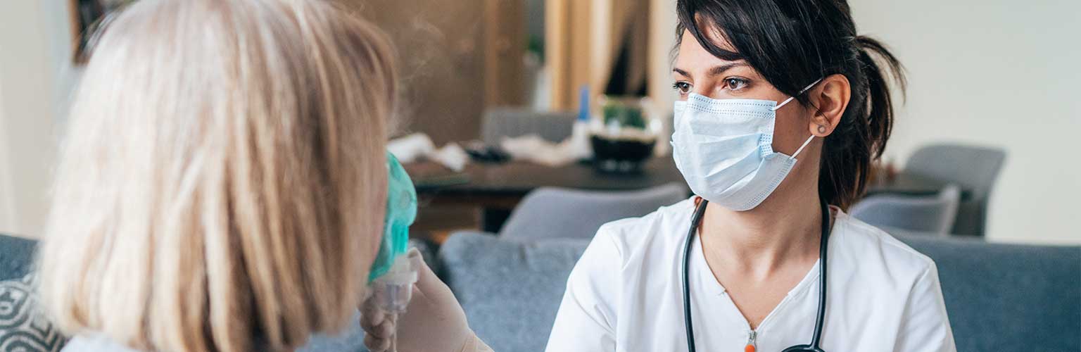 female nurse with female patient