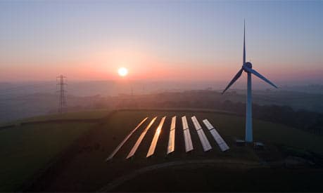 A wind turbine and solar panels