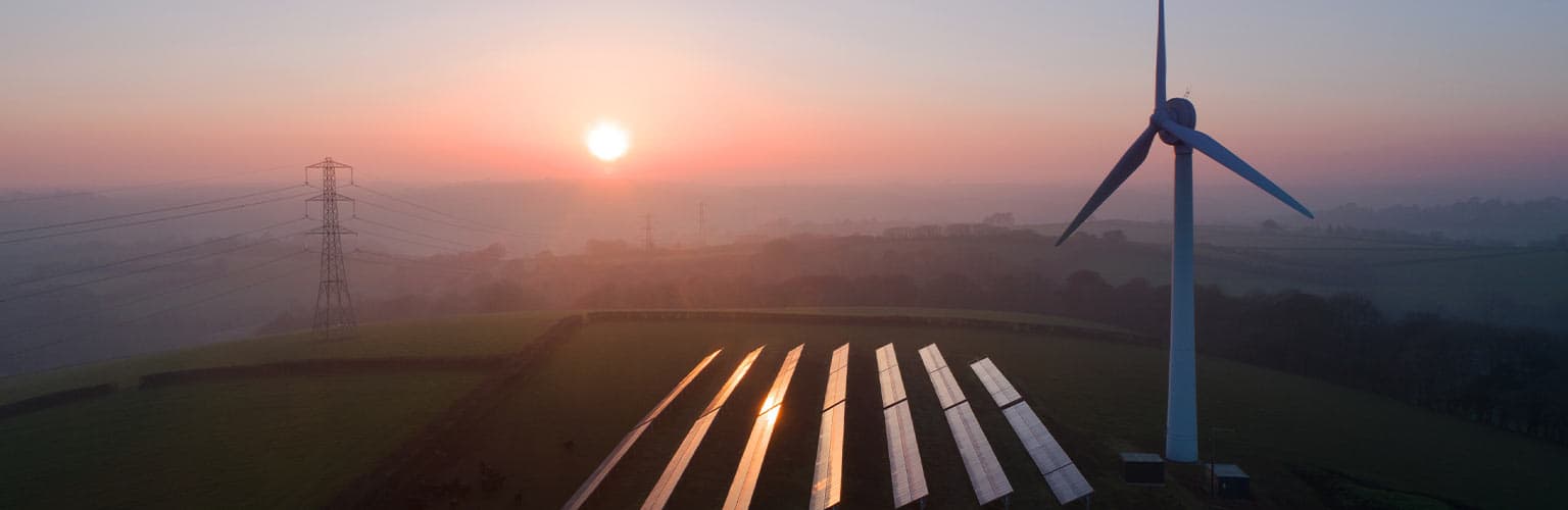 A wind turbine and solar panels