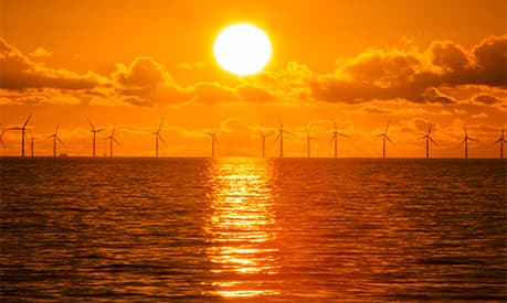 offshore windfarm at sunset