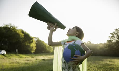 Female Eco-warrior shouting into a megaphone