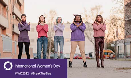 women making cross symbol