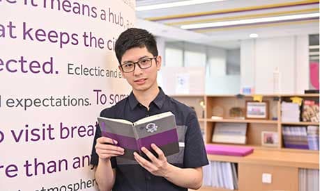 charles wang holding book