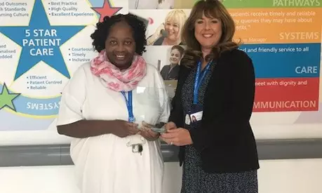 nurse being congratulated after winning award