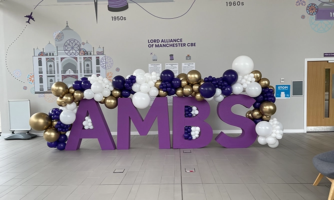 giant purple letters with balloons