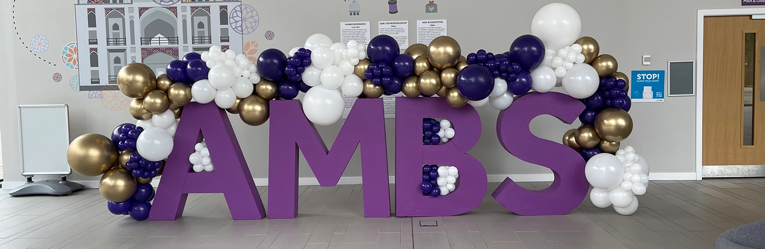 giant purple letters with balloons