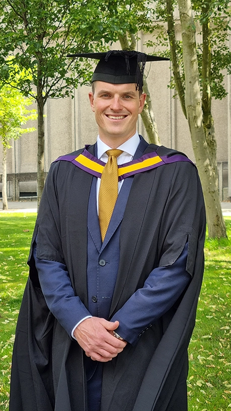 student in graduation gown