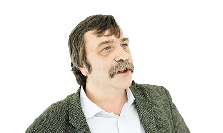 A professional headshot of Laszlo Czaban