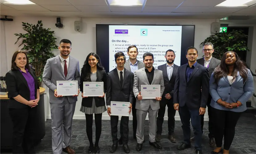 A group of the winners of the MBA Case Interview Competition holding certificates