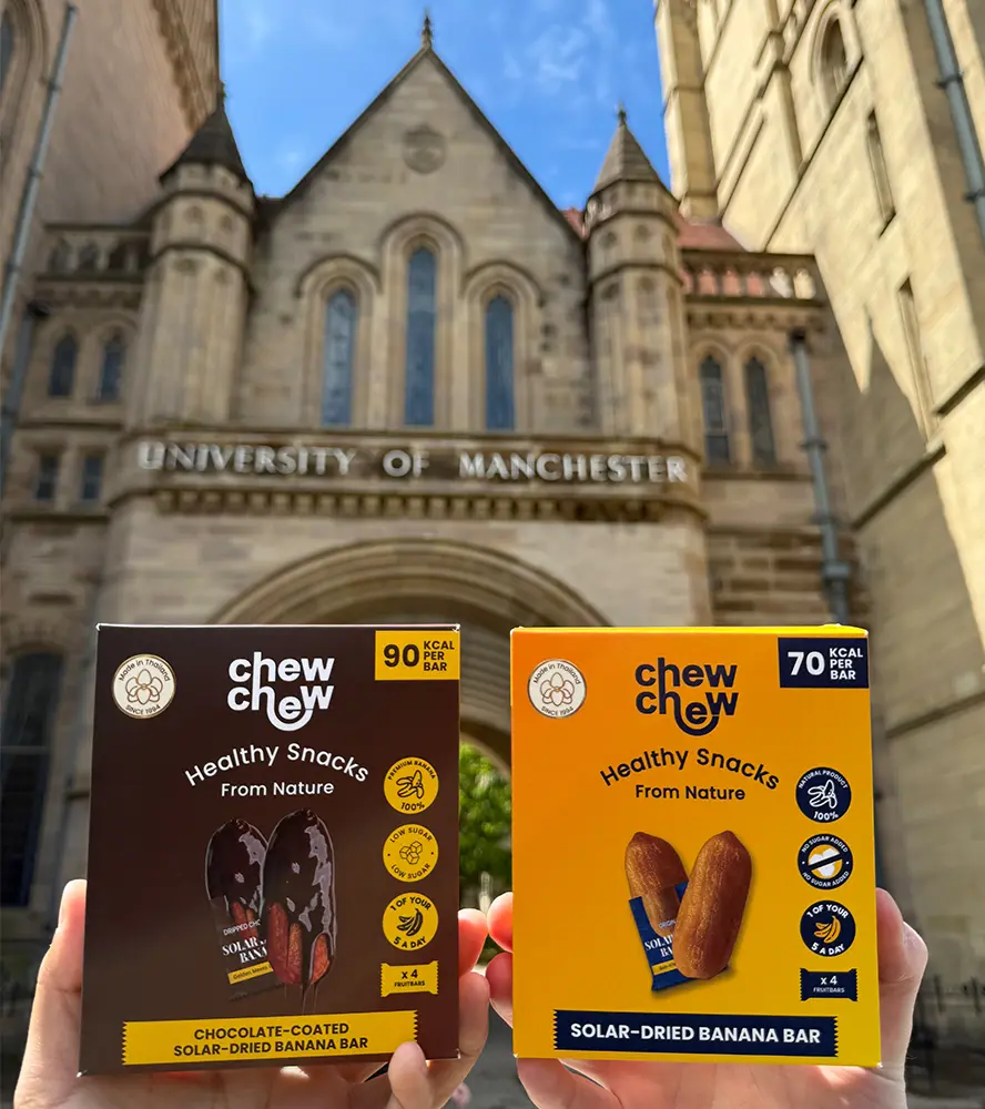 Chew Chew products in front of old University of Manchester building.