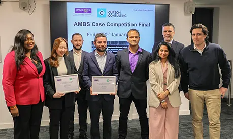 The winning team of the 2026 case competition with their certificates standing beside representatives from Curzon Consulting and the Postgraduate Careers Service.