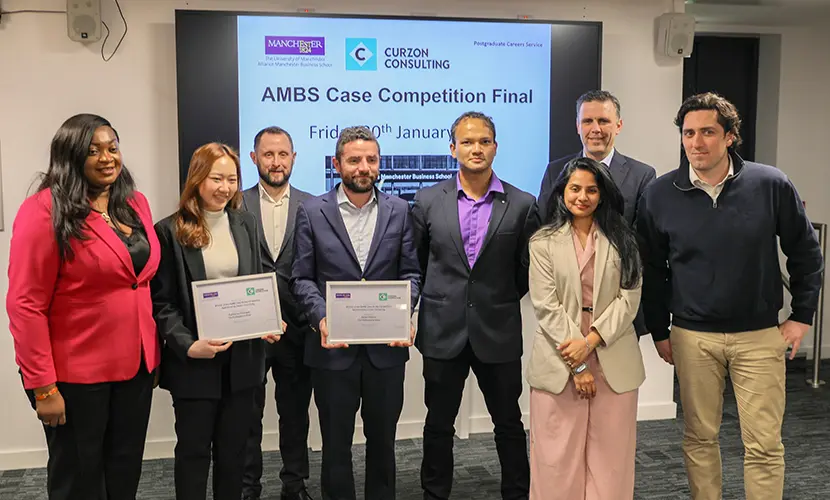 The winning team of the 2026 case competition with their certificates standing beside representatives from Curzon Consulting and the Postgraduate Careers Service.