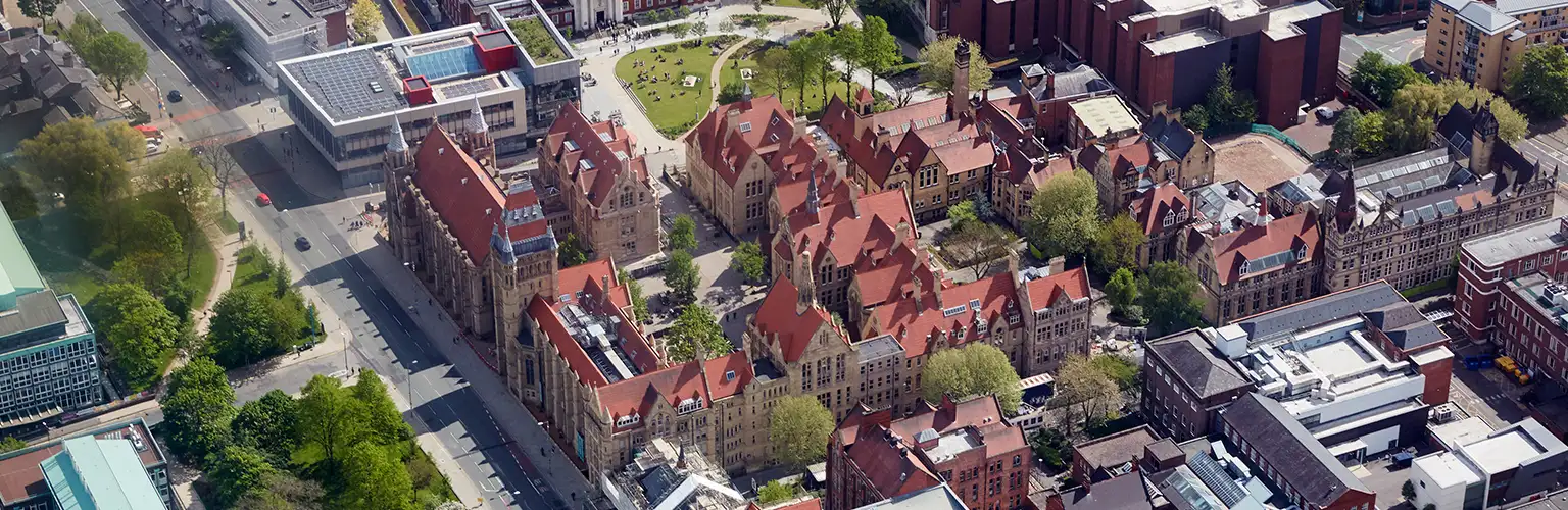 Aerial view of the buildings of the University of Manchester and Whitworth Hall.