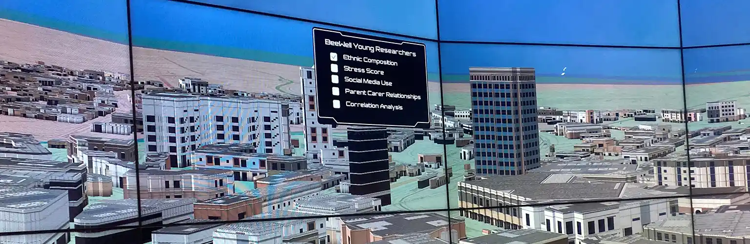Screens in the data visualisation observatory showing a digital model of a city.