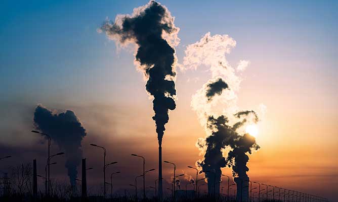 Factory pollution with sunset