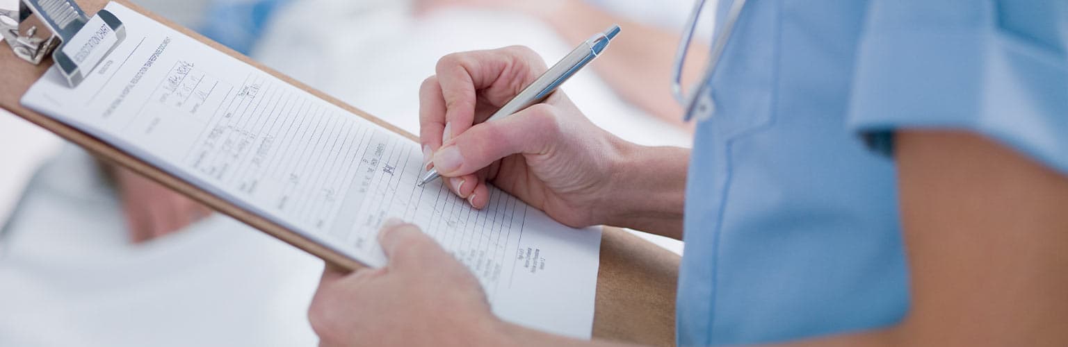 A nurse with a clipboard