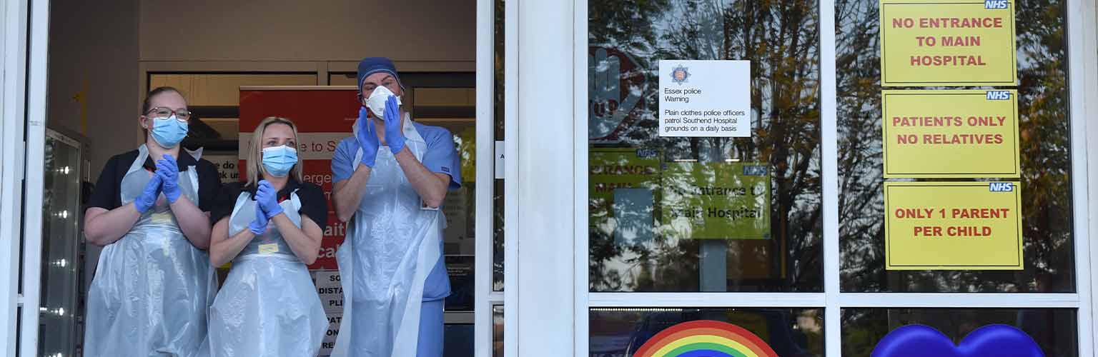 NHS workers clapping in PPE