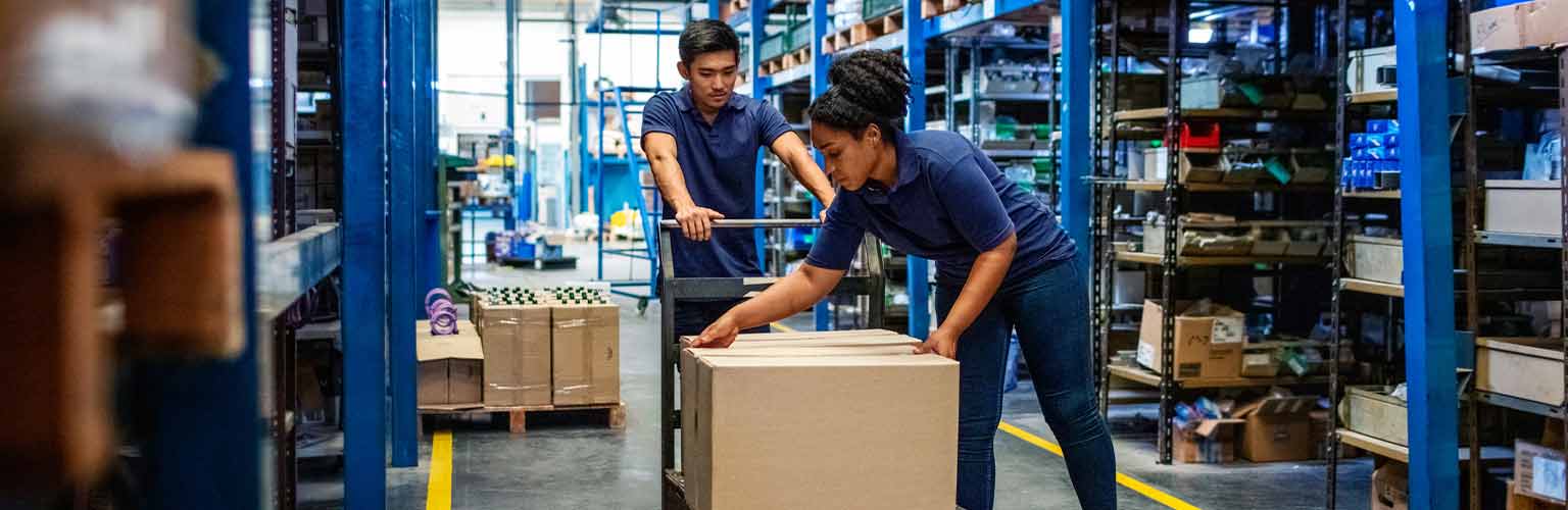 workers in a warehouse unloading a box