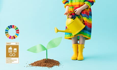 A child watering a plant with a blue background and the UN sustainable development goal logo in the bottom left of the picture