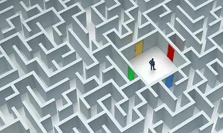 Man stood in the middle of a maze deciding which of four coloured doors to walk through
