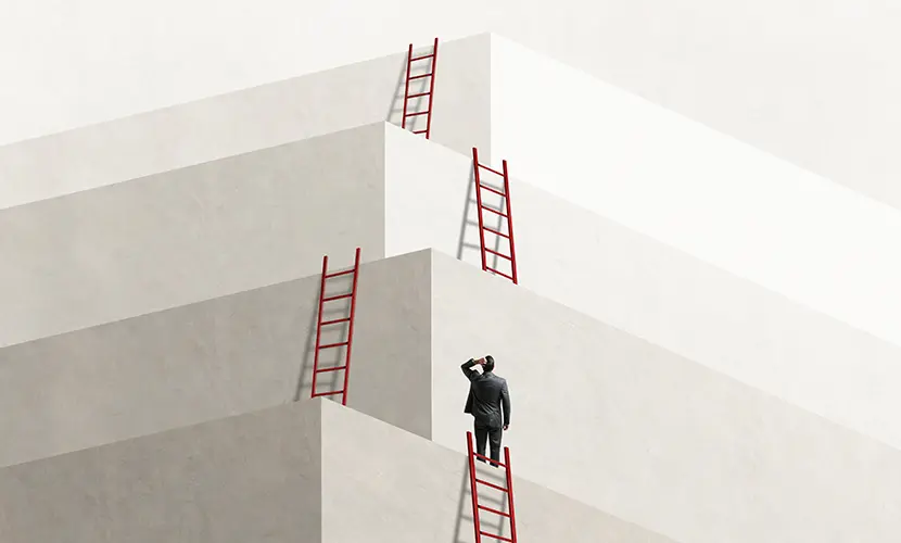 A man looks up at a series of ladders that lead him to the next level, eventually reaching the top.