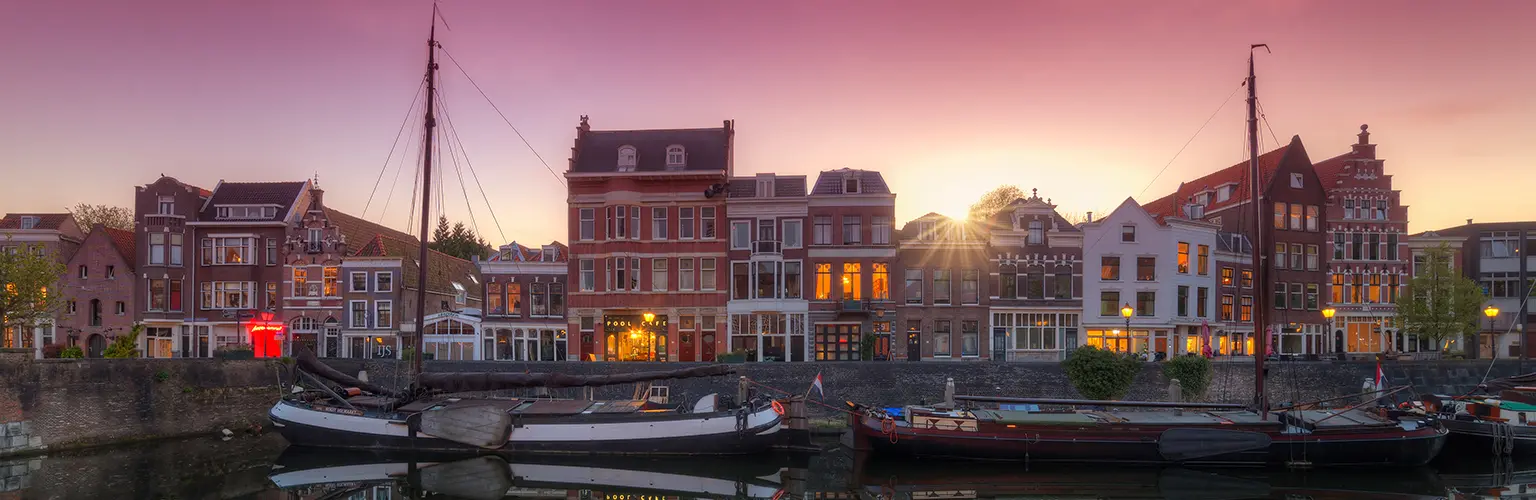 Dutch flat bottomed boats in the old port of Delfshaven in Rotterdam.