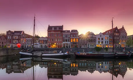 Dutch flat bottomed boats in the old port of Delfshaven in Rotterdam.