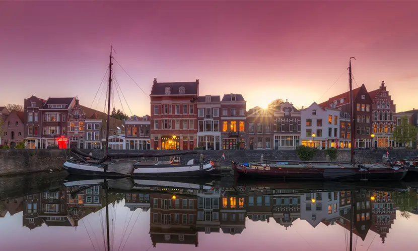 Dutch flat bottomed boats in the old port of Delfshaven in Rotterdam.