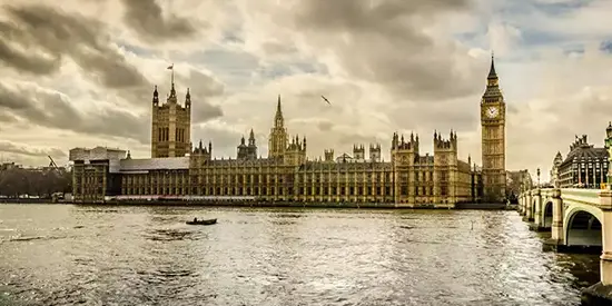 The Houses of Parliament and Big Ben by the River Thames, representing UK news and public affairs.