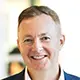 A professional headshot of Mark Healey.