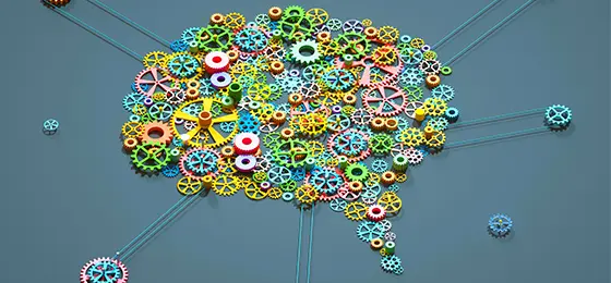 A speech bubble made up of cogs to represent thinking.