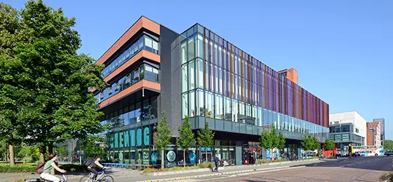 Alliance MBS building taken from Oxford Road on a blue sky day.