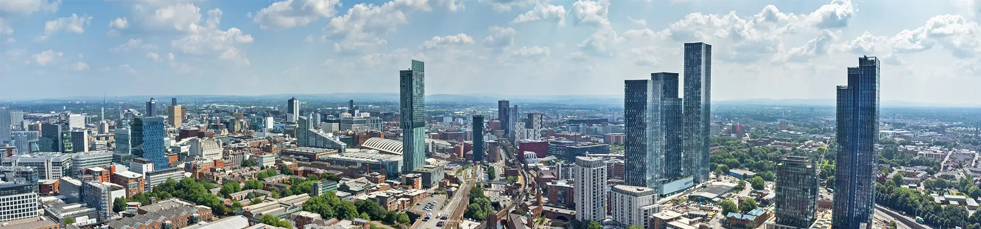 Wide angle aerial view of the skyline of Manchester, England, UK