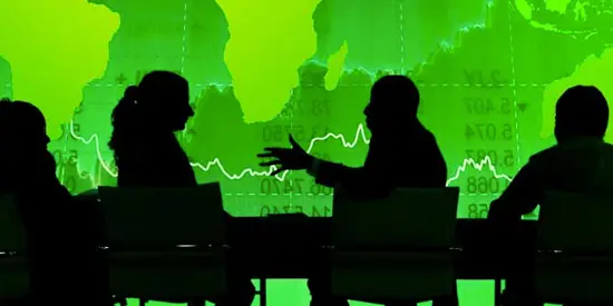 Business discussion on green background showing a map