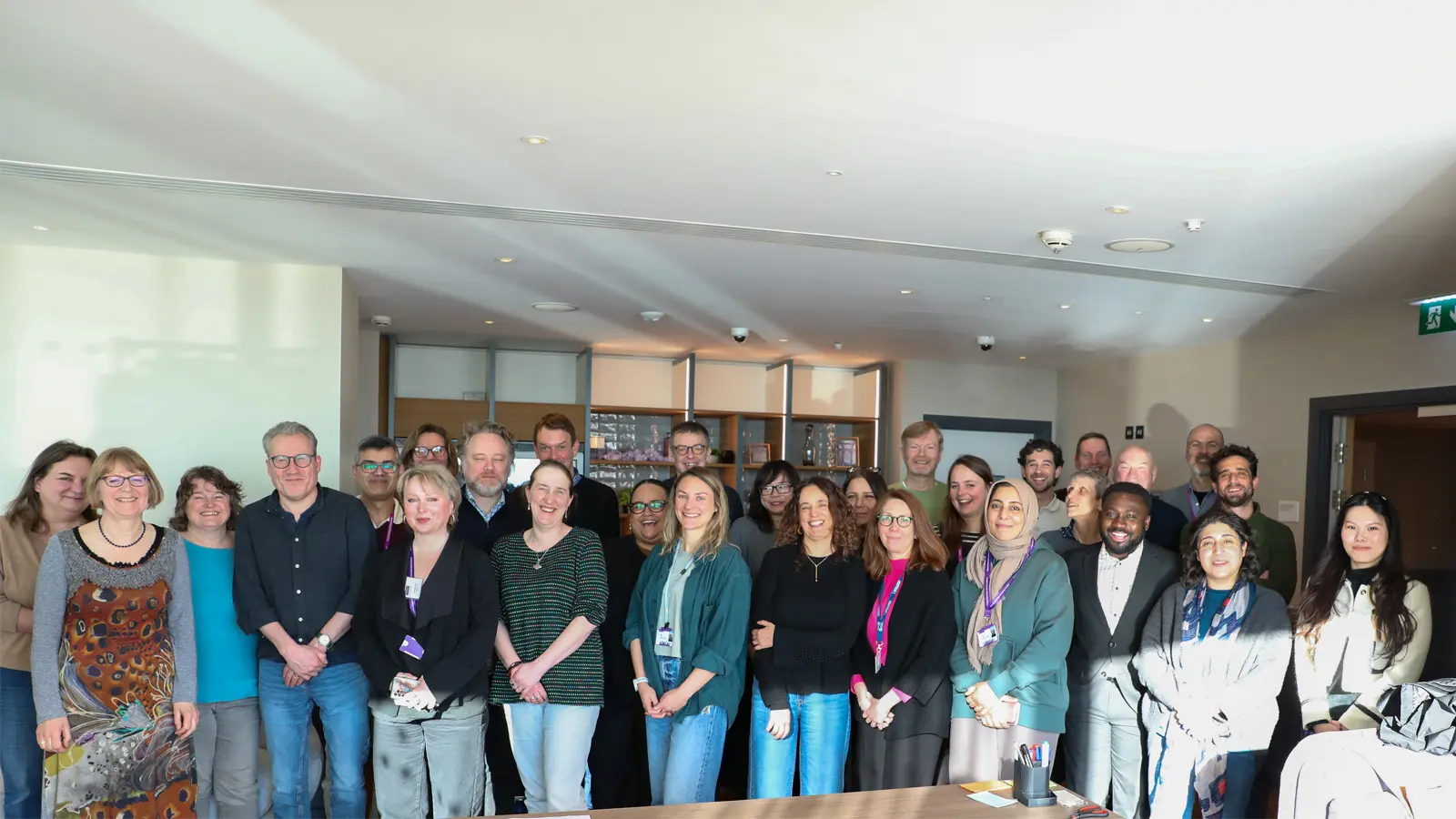 The People, Management and Organisations (PMO) division team posing for a group photograph