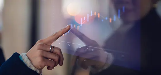 Female finger touching digital display screen.