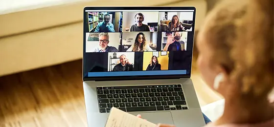 Woman attending webinar from home.