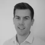 A black and white headshot of Thomas Allen.