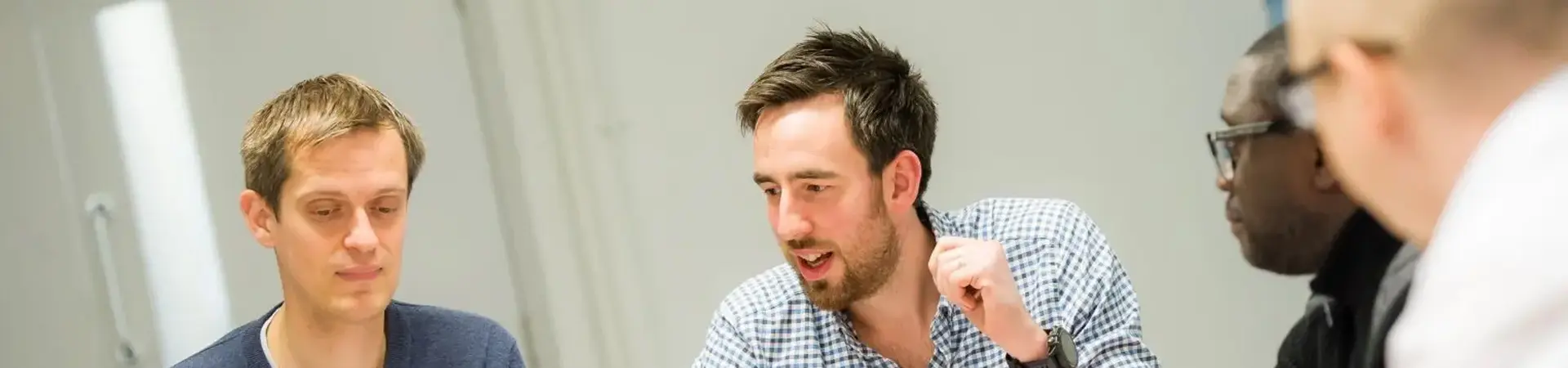 Students collaborating in a classroom, discussing career development and professional growth opportunities