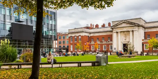 Students sat in Gilbert Square at The University of Manchester